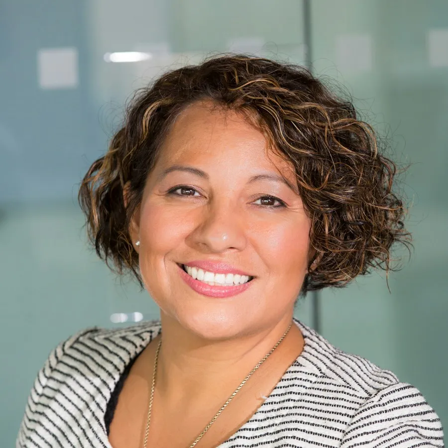 A smiling woman in an office